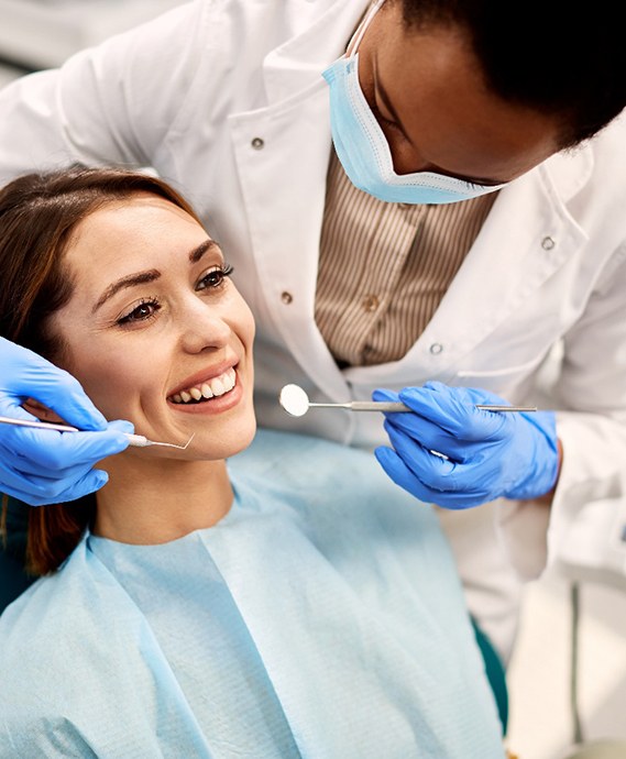 Smiling woman about to have her teeth examined