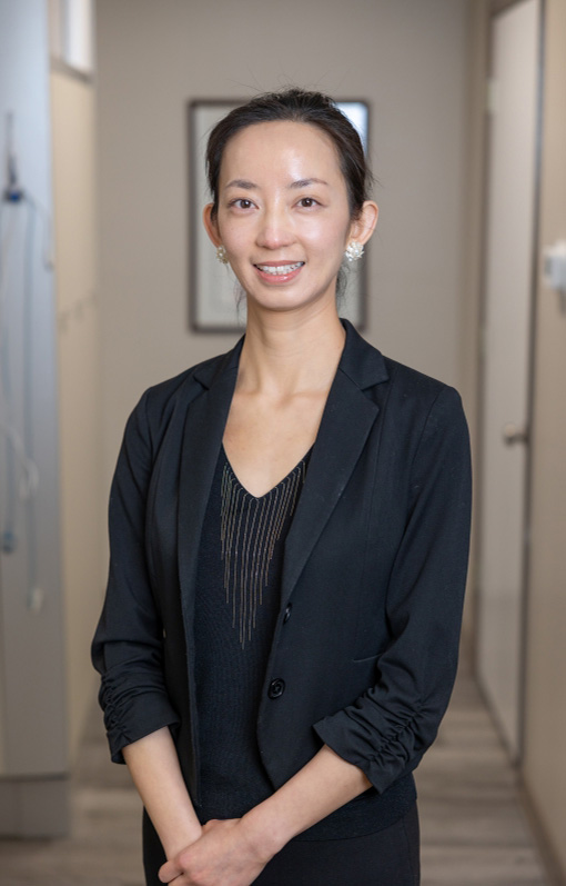 Doctor Wang smiling at a patient