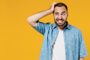 Man with embarrassed expression.